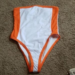 One piece swimsuit. New with tags. Size Medium. M